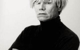 Black and white portrait of Andy Warhol.