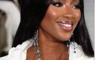 Naomi Campbell, model, long black hair.