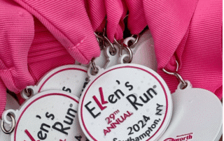 Medals for the 29th Annual Ellen's Run 2024 in Southampton, NY, with pink ribbons.